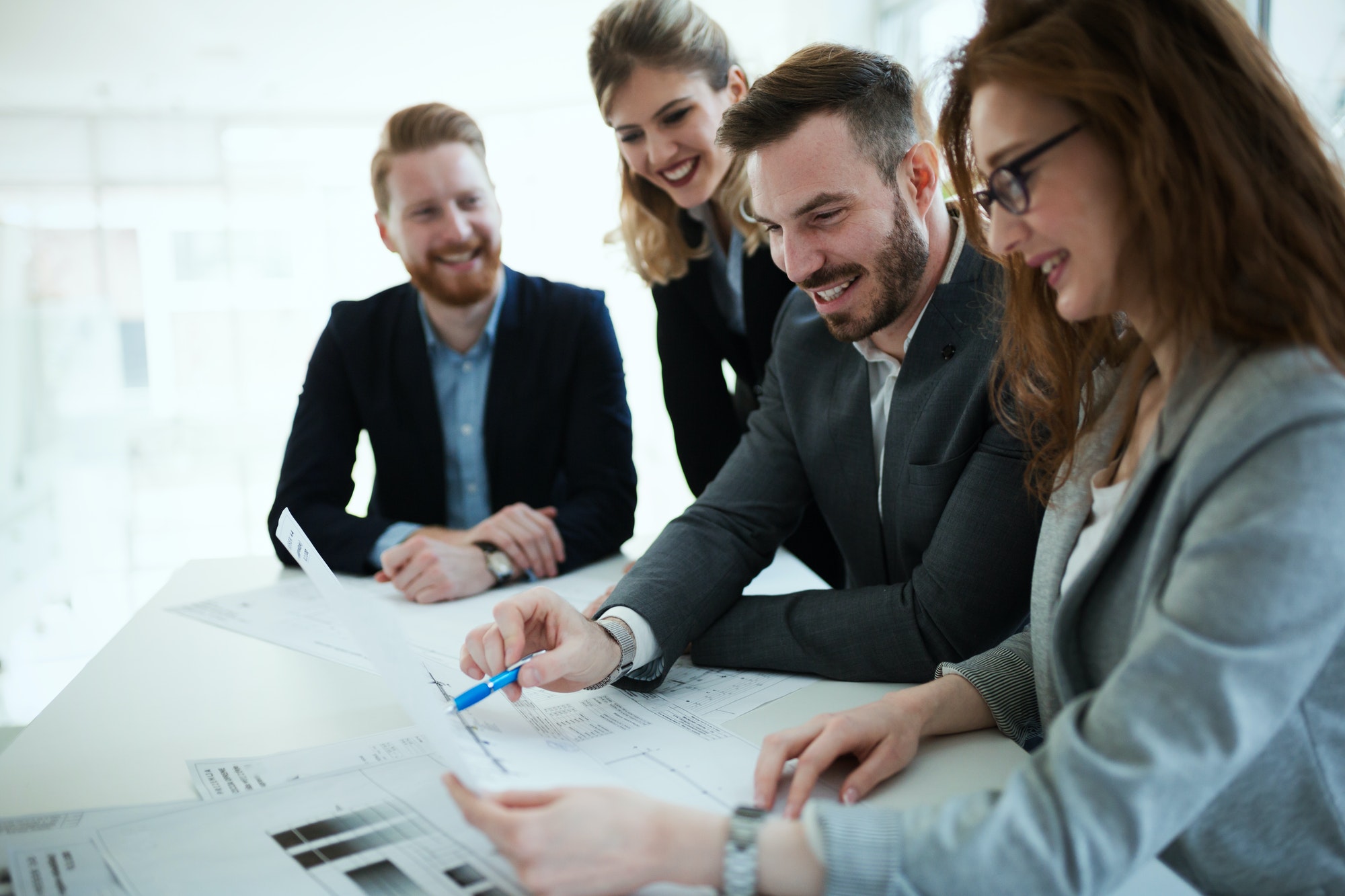 business-people-working-together-on-project-and-brainstorming-in-office.jpg